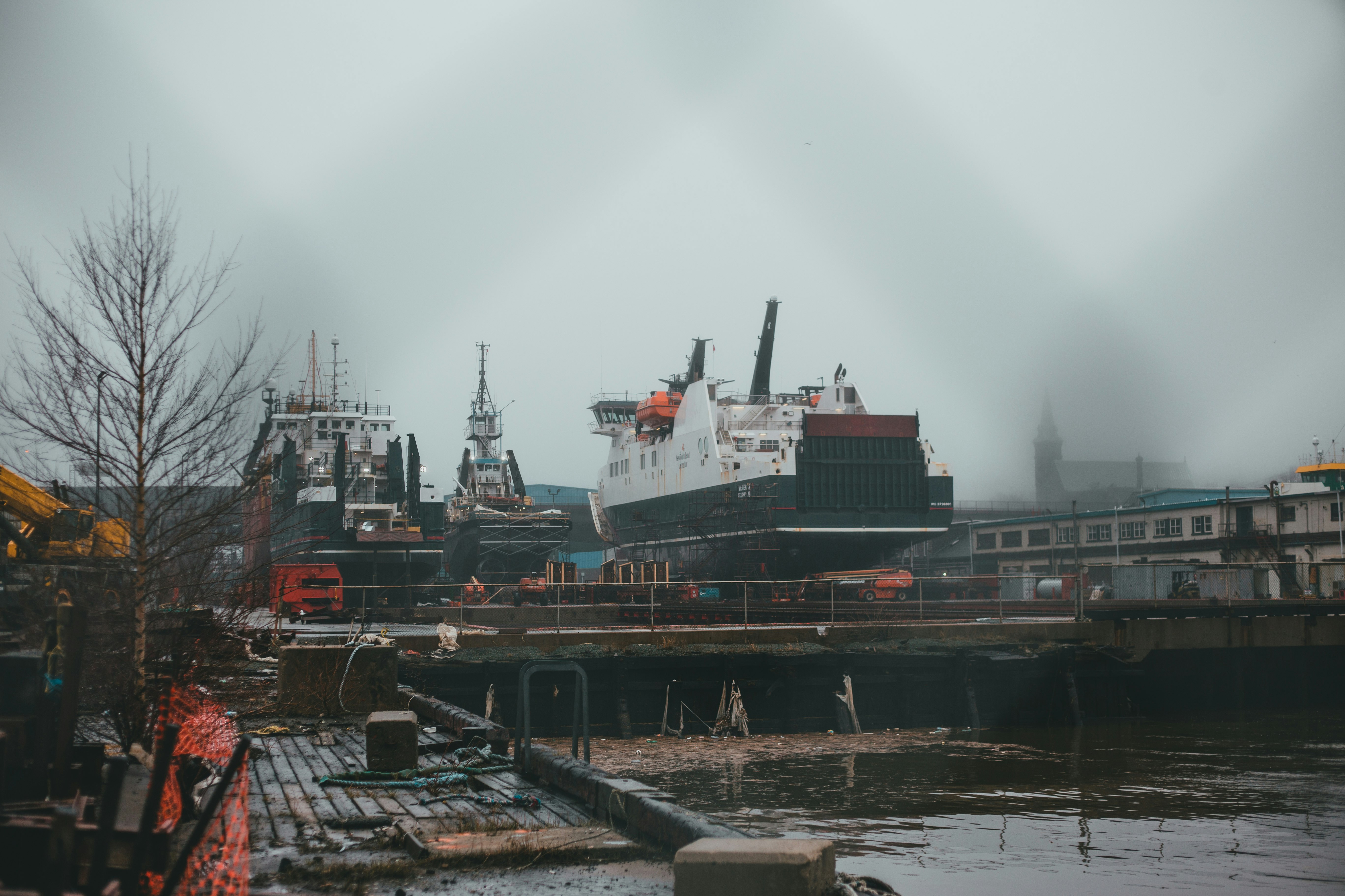 white and black ship on dock during daytime